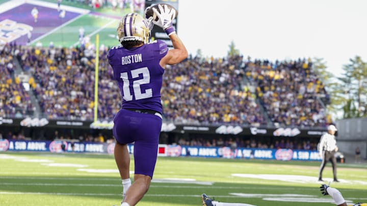 Oct 5, 2024; Seattle, Washington, USA; Washington Huskies wide receiver Denzel Boston (12) catches a touchdown pass against the Michigan Wolverines during the first quarter at Alaska Airlines Field at Husky Stadium. Mandatory Credit: Joe Nicholson-Imagn Images