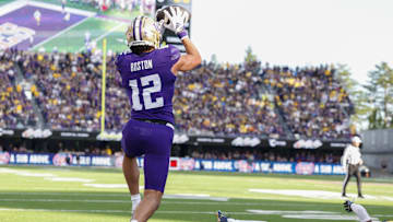 Oct 5, 2024; Seattle, Washington, USA; Washington Huskies wide receiver Denzel Boston (12) catches a touchdown pass against the Michigan Wolverines during the first quarter at Alaska Airlines Field at Husky Stadium. Mandatory Credit: Joe Nicholson-Imagn Images