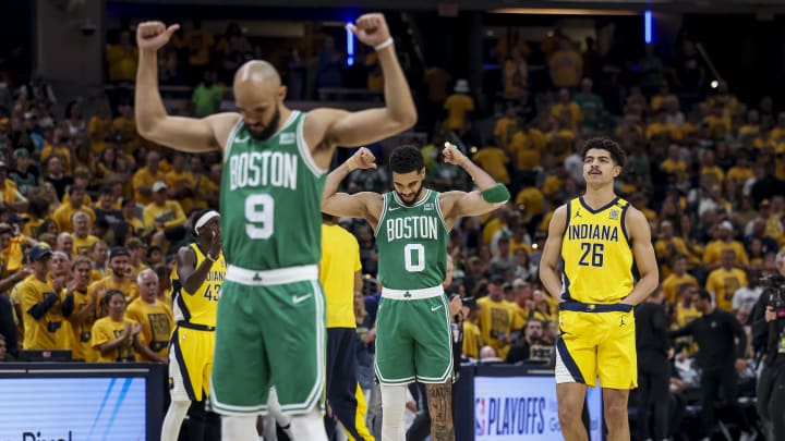 May 27, 2024; Indianapolis, Indiana, USA; Boston Celtics guard Derrick White (9) and Boston Celtics forward Jayson Tatum (0) react to a play during the first quarter during game four of the eastern conference finals for the 2024 NBA playoffs at Gainbridge Fieldhouse. Mandatory Credit: Trevor Ruszkowski-USA TODAY Sports