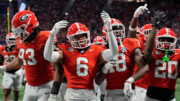 Georgia defensive back Daylen Everette (6) celebrates with his teammates after an interception against Texas during the second half of the 2024 SEC championship game at Mercedes-Benz Stadium in Atlanta.