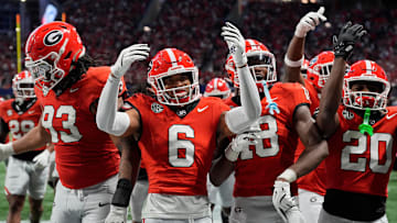Georgia defensive back Daylen Everette (6) celebrates with his teammates after an interception against Texas during the second half of the 2024 SEC championship game at Mercedes-Benz Stadium in Atlanta.