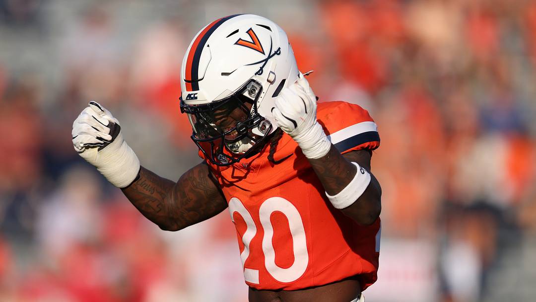 Aug 29, 2026; Charlottesville, Virginia, USA;  Virginia Cavaliers cornerback Omillio Agard (20) celebrates a defensive stop during the game against the North Carolina State Wolfpack at Scott Stadium.  Mandatory Credit: Greg Atkins-Imagn Images