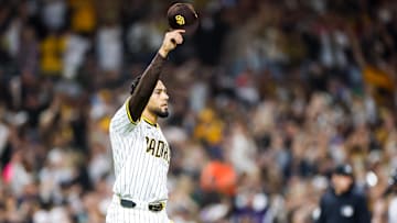 Apr 12, 2025; San Diego, California, USA;  San Diego Padres relief pitcher Robert Suarez (75) tips his hat after San Diego Padres right fielder Fernando Tatis Jr. (23) makes a leaping catch during the ninth inning to end the game against the Colorado Rockies at Petco Park. Mandatory Credit: David Frerker-Imagn Images