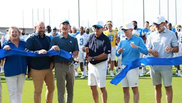 Jul 24, 2024; El Segundo, CA, USA;  Los Angeles Chargers owner and chairman of the board Dean Spanos cuts a ribbon to celebrating the official opening of The Bolt prior to the first day of training camp. Mandatory Credit: Kiyoshi Mio-Imagn Images