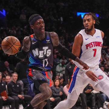Apr 6, 2024; Brooklyn, New York, USA; Brooklyn Nets point guard Dennis Schroder (17) passes the ball against Detroit Pistons small forward Troy Brown Jr. (7) during the second half at Barclays Center. Mandatory Credit: Gregory Fisher-USA TODAY Sports