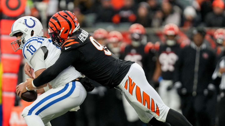 Cincinnati Bengals defensive end Trey Hendrickson (91) sacks Indianapolis Colts quarterback Gardner Minshew II (10) on Sunday, Dec. 10, 2023, during a game against the Cincinnati Bengals at Paycor Stadium in Cincinnati.