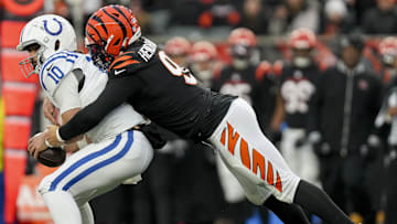 Dec 10, 2023; Cincinnati, Ohio, USA; Cincinnati Bengals defensive end Trey Hendrickson (91) sacks Indianapolis Colts quarterback Gardner Minshew II (10) at Paycor Stadium. Mandatory Credit: Jenna Watson-Imagn Images