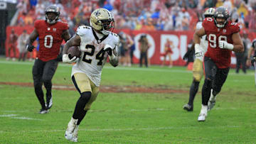 Dec 7, 2025; Tampa, Florida, USA; New Orleans Saints running back Devin Neal (24) runs for a gain during the third quarter against the Tampa Bay Buccaneers at Raymond James Stadium. Mandatory Credit: Kim Klement Neitzel-Imagn Images