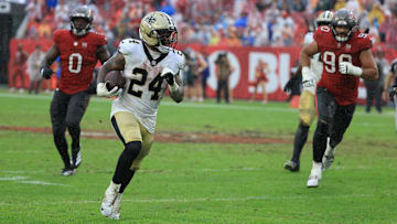 Dec 7, 2025; Tampa, Florida, USA; New Orleans Saints running back Devin Neal (24) runs for a gain during the third quarter against the Tampa Bay Buccaneers at Raymond James Stadium. Mandatory Credit: Kim Klement Neitzel-Imagn Images