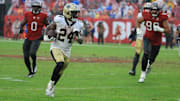 Dec 7, 2025; Tampa, Florida, USA; New Orleans Saints running back Devin Neal (24) runs for a gain during the third quarter against the Tampa Bay Buccaneers at Raymond James Stadium. Mandatory Credit: Kim Klement Neitzel-Imagn Images