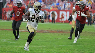 Dec 7, 2025; Tampa, Florida, USA; New Orleans Saints running back Devin Neal (24) runs for a gain during the third quarter against the Tampa Bay Buccaneers at Raymond James Stadium. Mandatory Credit: Kim Klement Neitzel-Imagn Images