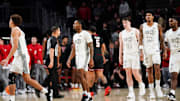 Cincinnati Bearcats players walk off the court after being defeated by the Texas Tech Red Raiders 81-71, Tuesday, Jan. 21, 2025, at Fifth Third Arena in Cincinnati.