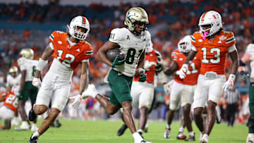 USF wide receiver Christian Neptune scored this touchdown against Miami but the Bulls took their first loss of the season.