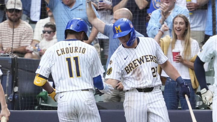 Jul 25, 2025; Milwaukee, Wisconsin, USA; Milwaukee Brewers outfielder Jackson Chourio (11) is congratulated by first base Andrew Vaughn (28) while rounding the bases after hitting a home run against the Miami Marlins in the fourth at American Family Field. Mandatory Credit: Michael McLoone-Imagn Images