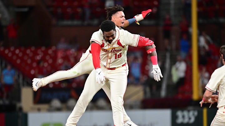 Sep 6, 2025; St. Louis, Missouri, USA;  St. Louis Cardinals outfielder Jordan Walker (18, front) and St. Louis Cardinals shortstop Masyn Winn (0) leap in the air to celebrate their 3-2 win over the San Francisco Giants after Walker doubled to left, scoring Winn and teammate St. Louis Cardinals second baseman Garrett Hampson (not shown) in the bottom of the ninth inning at Busch Stadium. Mandatory Credit: Tim Vizer-Imagn Images