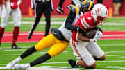 Nov 28, 2025; Lincoln, Nebraska, Nebraska Cornhuskers wide receiver Dane Key (6) is tackled by Iowa Hawkeyes defensive back Rashad Godfrey Jr. (7) during the fourth quarter at Memorial Stadium. 