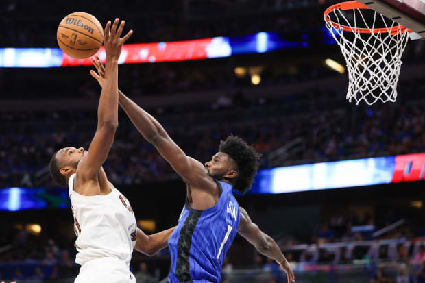 Orlando Magic forward Jonathan Isaac (1) blocks the shot of Cleveland Cavaliers forward Evan Mobley (4).