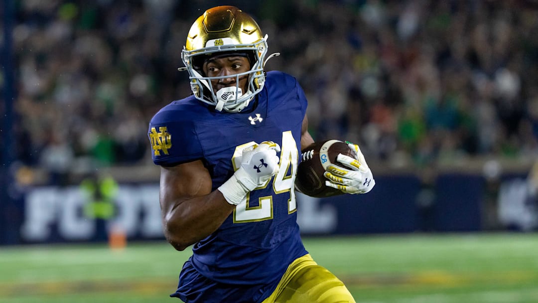 Oct 18, 2025; South Bend, Indiana, USA;  Notre Dame Fighting Irish running back Jadarian Price (24) runs the ball during the first half at Notre Dame Stadium. Mandatory Credit: Michael Caterina-Imagn Images