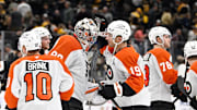 Sep 29, 2025; Boston, Massachusetts, USA;  Philadelphia Flyers right wing Garnet Hathaway (19) and goaltender Dan Vladar (80) celebrate defeating the Boston Bruins after a shootout at TD Garden. Mandatory Credit: Eric Canha-Imagn Images