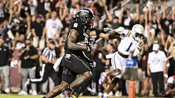 Oct 26, 2024; College Station, Texas, USA; Texas A&M Aggies running back Le'Veon Moss (8) runs the ball into the end zone for a touchdown during the first quarter against the LSU Tigers at Kyle Field. Mandatory Credit: Maria Lysaker-Imagn Images. 