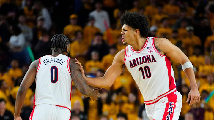 Arizona forward Koa Peat (10) celebrates with guard Jaden Bradley (0).