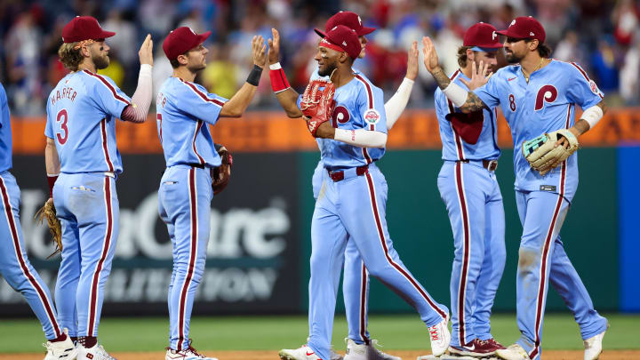 Jul 11, 2024; Philadelphia, Pennsylvania, USA; The Philadelphia Phillies high five each other after a victory against the Los Angeles Dodgers at Citizens Bank Park