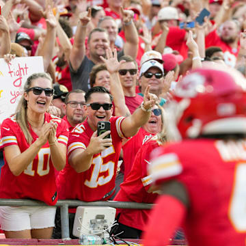 Sep 15, 2024; Kansas City, Missouri, USA; Kansas City Chiefs fans celebrate after a touchdown by Kansas City Chiefs wide receiver Rashee Rice (4) during the first half against the Cincinnati Bengals at GEHA Field at Arrowhead Stadium. Mandatory Credit: Jay Biggerstaff-Imagn Images