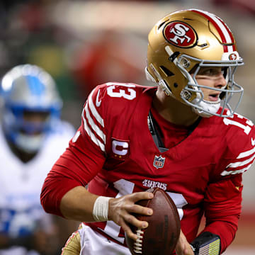San Francisco 49ers quarterback Brock Purdy looks to pass the ball.