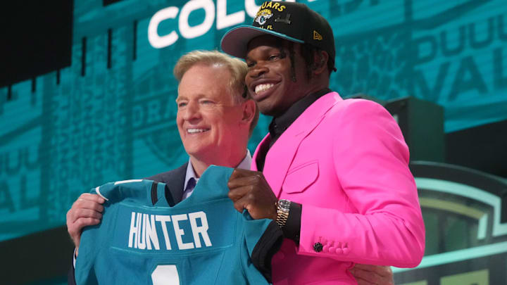 Apr 24, 2025; Green Bay, WI, USA; NFL commissioner Roger Goodell stands with Colorado Buffaloes wide receiver Travis Hunter after he is selected by the Jacksonville Jaguars as the number two pick in the first round of the 2025 NFL Draft at Lambeau Field. 
