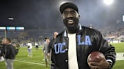 Nov 8, 2024; Pasadena, California, USA;  UCLA Bruins head coach DeShaun Foster leaves the field with the game ball after defeating the Iowa Hawkeyes at the Rose Bowl. Mandatory Credit: Jayne Kamin-Oncea-Imagn Images