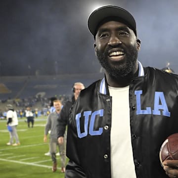 Nov 8, 2024; Pasadena, California, USA;  UCLA Bruins head coach DeShaun Foster leaves the field with the game ball after defeating the Iowa Hawkeyes at the Rose Bowl. Mandatory Credit: Jayne Kamin-Oncea-Imagn Images