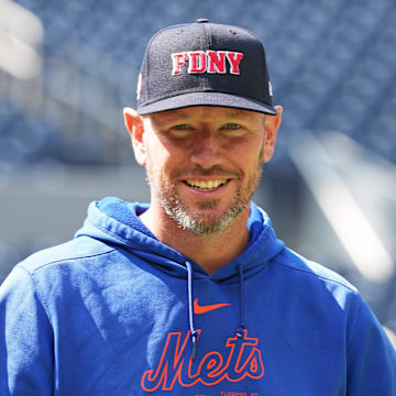 Sep 11, 2024; Toronto, Ontario, CAN; New York Mets pitching coach Jeremy Hefner (65) walks towards the outfield wearing a City of New York Fire Department baseball cap during batting practice before a game against the Toronto Blue Jays at Rogers Centre. Mandatory Credit: Nick Turchiaro-Imagn Images