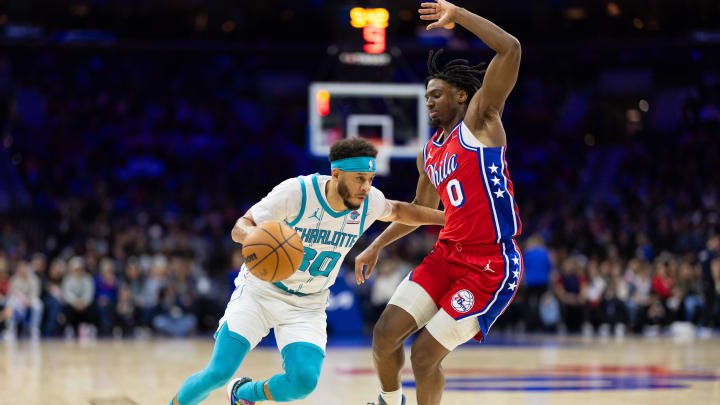 Mar 1, 2024; Philadelphia, Pennsylvania, USA; Charlotte Hornets guard Seth Curry (30) dribbles the ball against Philadelphia 76ers guard Tyrese Maxey (0) during the third quarter at Wells Fargo Center. Mandatory Credit: Bill Streicher-USA TODAY Sports