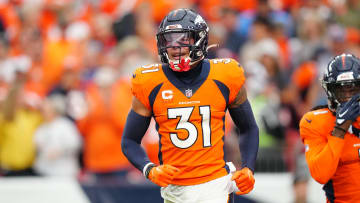 Sep 10, 2023; Denver, Colorado, USA; Denver Broncos safety Justin Simmons (31) reacts to a turnover in the third quarter against the Las Vegas Raiders at Empower Field at Mile High. Mandatory Credit: Ron Chenoy-USA TODAY Sports