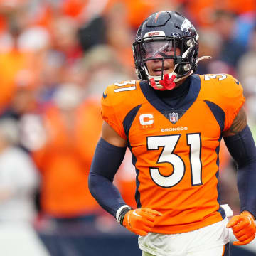 Sep 10, 2023; Denver, Colorado, USA; Denver Broncos safety Justin Simmons (31) reacts to a turnover in the third quarter against the Las Vegas Raiders at Empower Field at Mile High. Mandatory Credit: Ron Chenoy-USA TODAY Sports