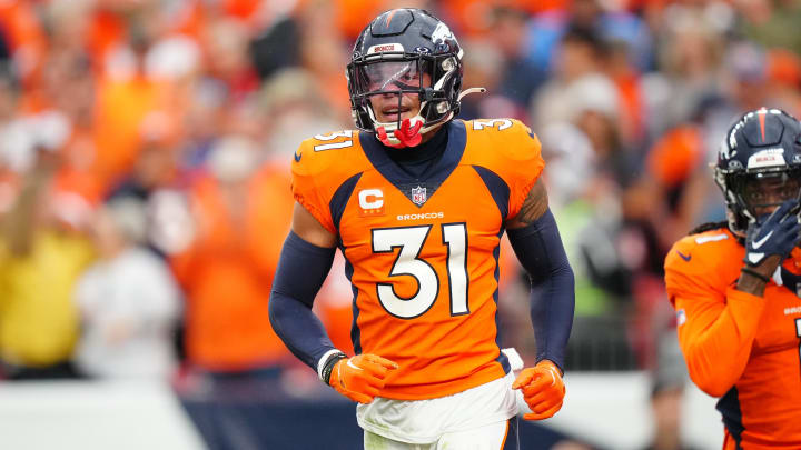 Sep 10, 2023; Denver, Colorado, USA; Denver Broncos safety Justin Simmons (31) reacts to a turnover in the third quarter against the Las Vegas Raiders at Empower Field at Mile High. Mandatory Credit: Ron Chenoy-USA TODAY Sports