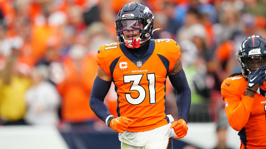 Sep 10, 2023; Denver, Colorado, USA; Denver Broncos safety Justin Simmons (31) reacts to a turnover in the third quarter against the Las Vegas Raiders at Empower Field at Mile High. Mandatory Credit: Ron Chenoy-Imagn Images