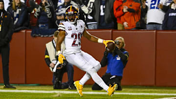 Jan 8, 2023; Landover, Maryland, USA; Washington Commanders cornerback Kendall Fuller (29) returns an interception for a touchdown against the Dallas Cowboys during the first half at FedExField.