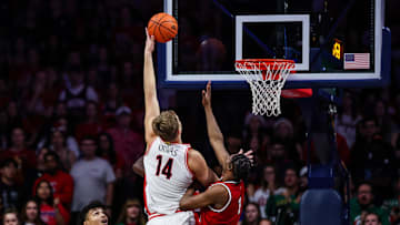 Dec 7, 2024; Tucson, Arizona, USA; Arizona Wildcats center Motiejus Krivas (14) goes for a lay up while Southern Utah Thunderbirds forward Jeffrey Langston Jr. (7) attempts to block him during the first half at McKale Center. Mandatory Credit: Aryanna Frank-Imagn Images