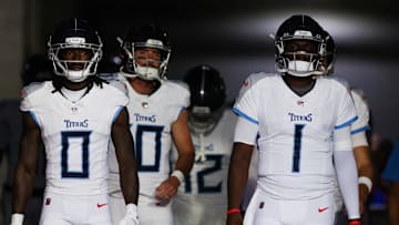 Aug 9, 2025; Tampa, Florida, USA; Tennessee Titans wide receiver Calvin Ridley (0) and quarterback Cameron Ward (1) take the field for warmups before a preseason game against the Tampa Bay Buccaneers at Raymond James Stadium. Mandatory Credit: Nathan Ray Seebeck-Imagn Images