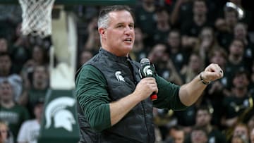 Dec 2, 2025; East Lansing, Michigan, USA;  Michigan State head football coach Pat Fitzgerald watches the Spartans defeat the Iowa Hawkeyes at Jack Breslin Student Events Center. Mandatory Credit: Dale Young-Imagn Images