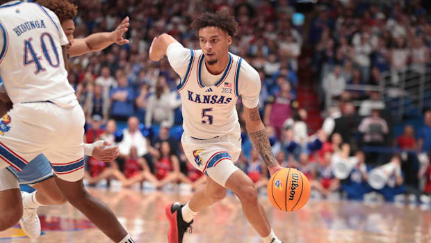 Kansas Jayhawks guard Zeke Mayo (5) drives the ball in the first half of the game against the North Carolina Tar Heels.