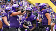 TCU Horned Frogs tight end Ka'Morreun Pimpton (88) reacts with offensive lineman Cooper Powers (77) and tight end Chase Curtis (81) after scoring a touchdown against the Baylor Bears during the second half of a game at Amon G. Carter Stadium. 