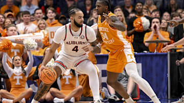 Mar 15, 2025; Nashville, TN, USA;  Auburn Tigers forward Johni Broome (4) backs down Tennessee Volunteers forward Felix Okpara (34) during the first half at Bridgestone Arena. Mandatory Credit: Steve Roberts-Imagn Images