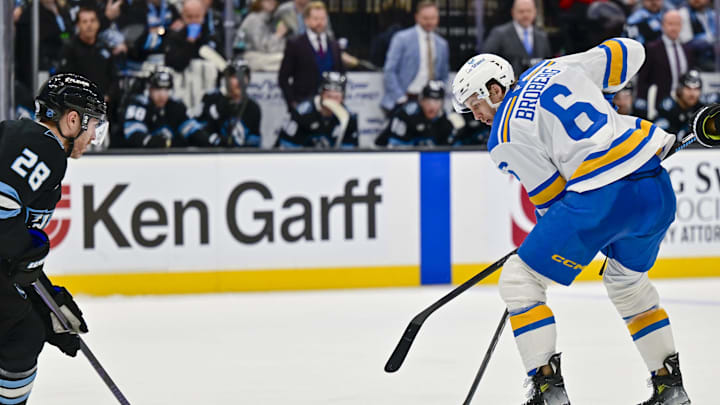 Jan 9, 2026; Salt Lake City, Utah, USA; Utah Mammoth defenseman Ian Cole (28) looks to defend the center from St. Louis Blues defenseman Philip Broberg (6) during third period at Delta Center. Mandatory Credit: Peter Creveling-Imagn Images