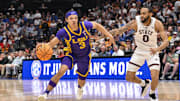 Mar 12, 2025; Nashville, TN, USA; LSU Tigers guard Curtis Givens III (3) dribbles past Mississippi State Bulldogs guard Claudell Harris Jr. (0) during the second half at Bridgestone Arena. Mandatory Credit: Steve Roberts-Imagn Images