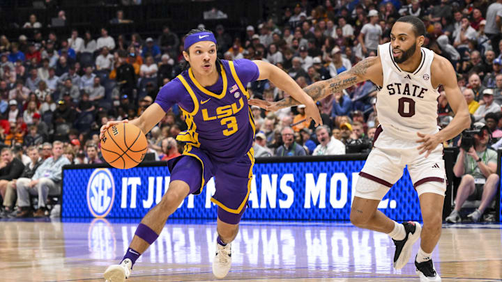 Mar 12, 2025; Nashville, TN, USA; LSU Tigers guard Curtis Givens III (3) dribbles past Mississippi State Bulldogs guard Claudell Harris Jr. (0) during the second half at Bridgestone Arena. Mandatory Credit: Steve Roberts-Imagn Images Mar 12, 2025; Nashville, TN, USA; LSU Tigers guard Curtis Givens III (3) dribbles past Mississippi State Bulldogs guard Claudell Harris Jr. (0) during the second half at Bridgestone Arena. Mandatory Credit: Steve Roberts-Imagn Images