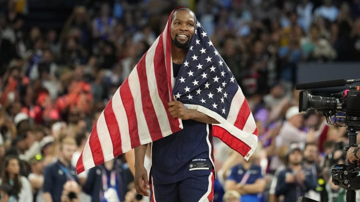 Kevin Durant celebrates after defeating France in the men's basketball gold medal game during the Paris 2024 Olympic Summer Games at Accor Arena. 