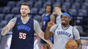 Jun 4, 2025; Oklahoma City, OK, USA; Oklahoma City Thunder center Isaiah Hartenstein (55) and guard Luguentz Dort (5) during NBA Finals Media Day at Paycom Center. Mandatory Credit: Alonzo Adams-Imagn Images