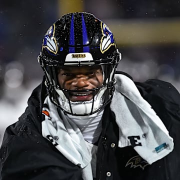 Jan 19, 2025; Orchard Park, New York, USA; Baltimore Ravens quarterback Lamar Jackson (8) warms up before a 2025 AFC divisional round game against the Buffalo Bills at Highmark Stadium. Mandatory Credit: Mark Konezny-Imagn Images
